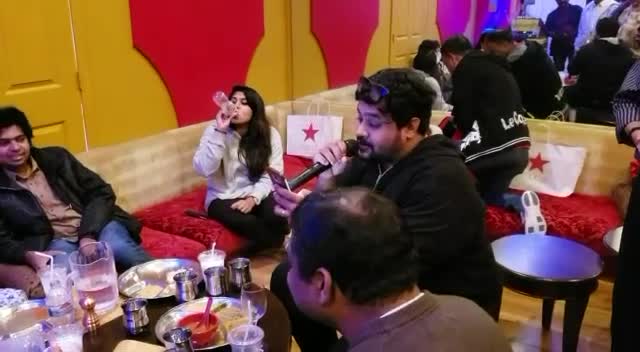 Guests sharing a karaoke evening at Chennai Kings