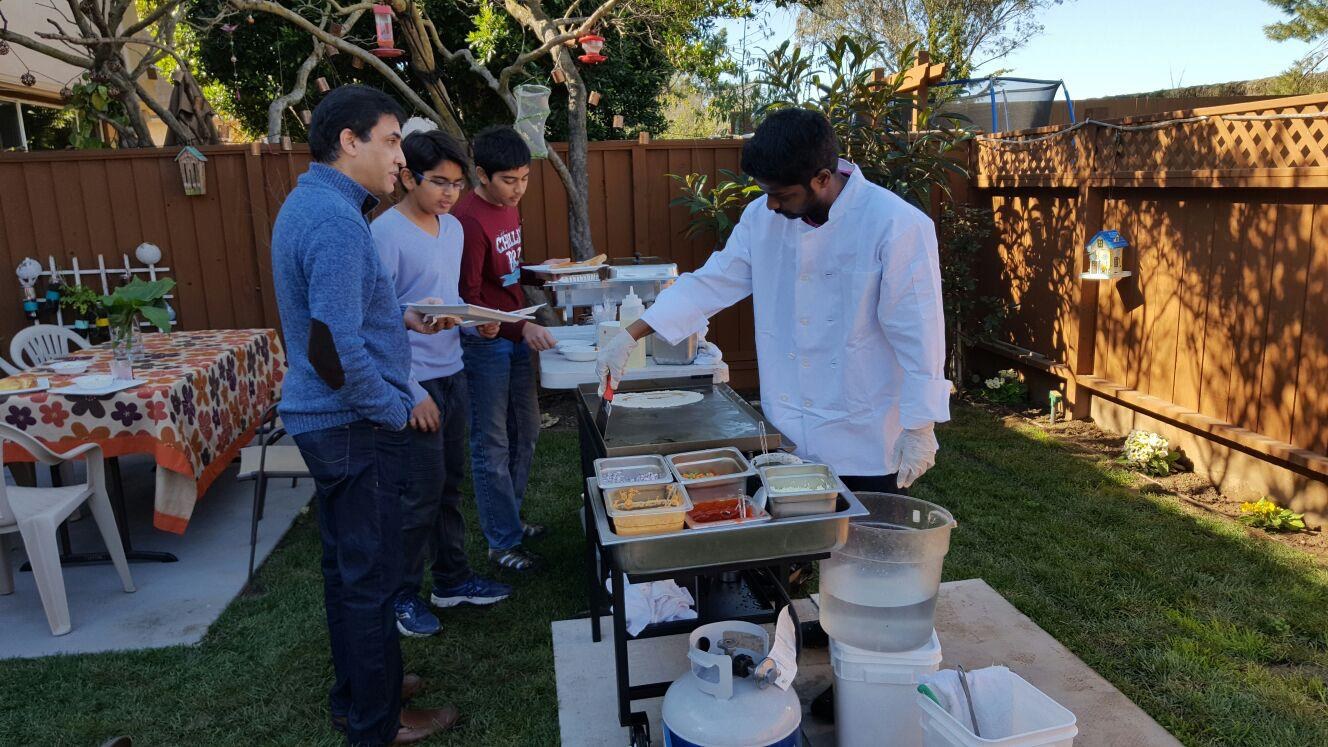 Chennai Kings chef preparing fresh dosas for guests at a backyard gathering